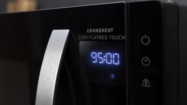 Imagen 7 Microondas sin plato de 23L con 800W y tecnología Flatbed. Dispone de 8 funciones preconfiguradas, panel táctil y temporizador de 95 min en elegante color negro.