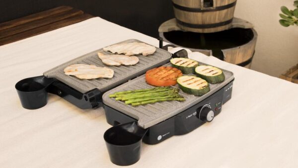 Imagen 5 Parrilla eléctrica de 1500 W con revestimiento RockStone antiadherente. Apertura de 180º, placa superior flotante y cajetín recogegrasas para cocina limpia.