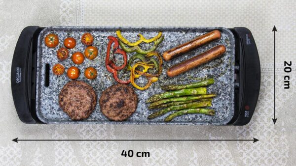Imagen 5 Plancha eléctrica de 1800 W con revestimiento RockStone de gran dureza y antiadherencia. Incluye termostato regulable, superficie amplia y cajetín recogegrasas.