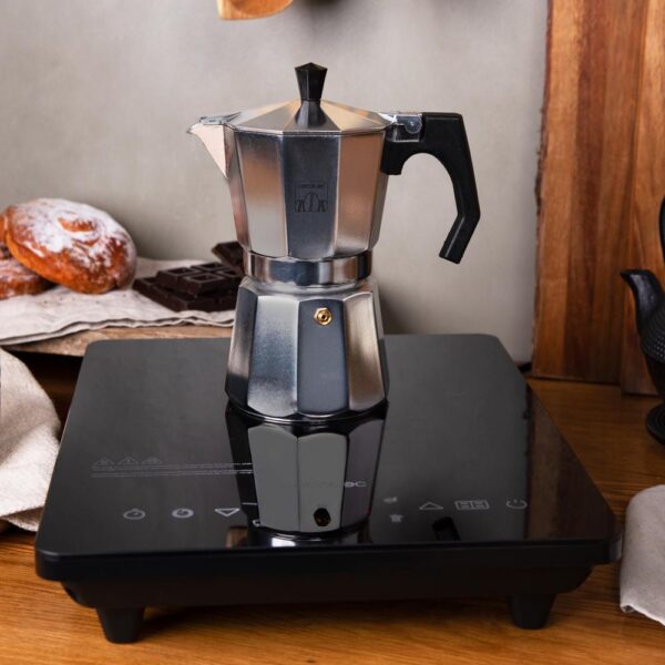 Imagen 6 Placa de inducción portátil Cecotec Full Crystal Onyx de 2000 W con cristal esmaltado, control táctil, 4 programas preconfigurados y temperatura regulable.