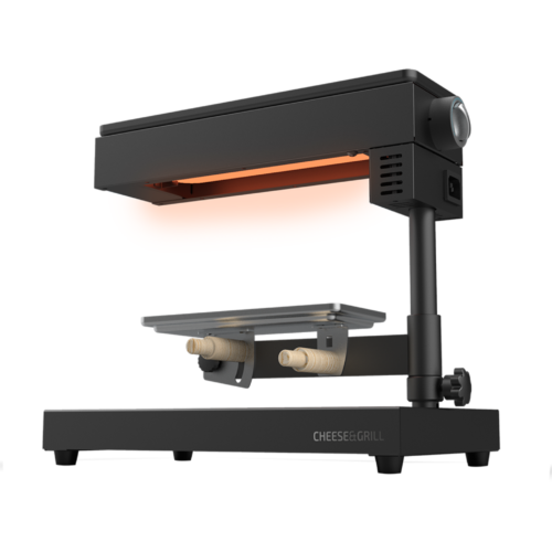 Imagen 2 Raclette Cheese&Grill 6000 Black de 600 W con función grill y acabados en acero inoxidable. Incluye parrilla antiadherente, termostato regulable y espátulas.