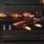 3081-Imagen-7 Imagen 7 Raclette Cheese&Grill 6000 Black de 600 W con función grill y acabados en acero inoxidable. Incluye parrilla antiadherente, termostato regulable y espátulas.