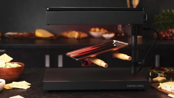3081-Imagen-7 Imagen 7 Raclette Cheese&Grill 6000 Black de 600 W con función grill y acabados en acero inoxidable. Incluye parrilla antiadherente, termostato regulable y espátulas.