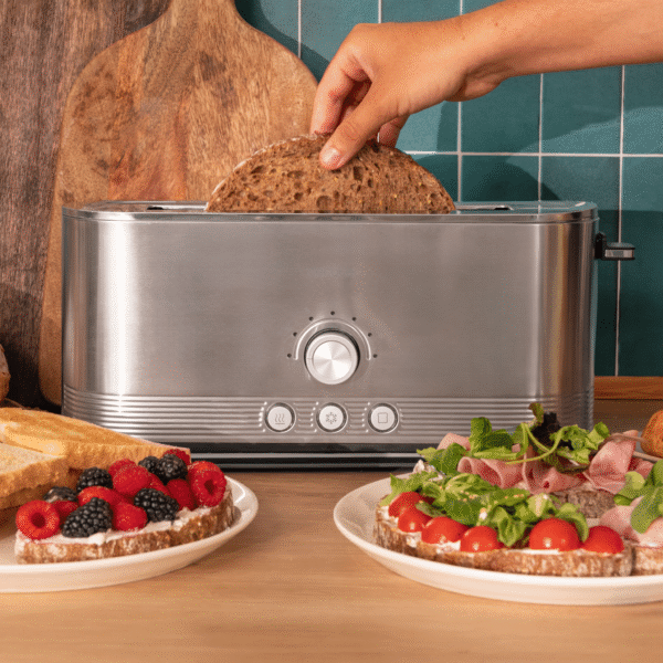 3286-Imagen-5 Imagen 5 Tostadora de acero inoxidable de 1050 W con 2 ranuras anchas de 3,8 cm. Incluye soporte para panecillos, anillo luminoso y sistema de autocentrado.