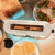 3286-Imagen-7 Imagen 7 Tostadora de acero inoxidable de 1050 W con 2 ranuras anchas de 3,8 cm. Incluye soporte para panecillos, anillo luminoso y sistema de autocentrado.