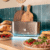 3286-Imagen-8 Imagen 8 Tostadora de acero inoxidable de 1050 W con 2 ranuras anchas de 3,8 cm. Incluye soporte para panecillos, anillo luminoso y sistema de autocentrado.