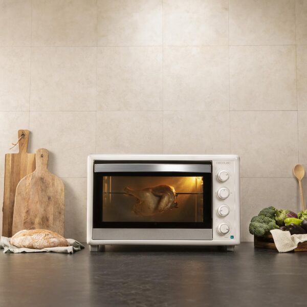 Imagen 6 Horno de convección Bake&Toast 6090 White Gyro de 60 litros. Con 2200 W de potencia, rustidor giratorio y 12 funciones de cocinado para resultados profesionales.