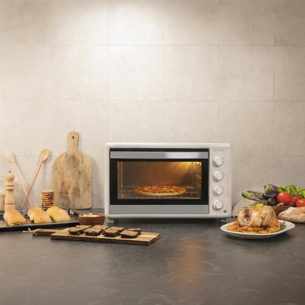 Imagen 8 Horno de convección Bake&Toast 6090 White Gyro de 60 litros. Con 2200 W de potencia, rustidor giratorio y 12 funciones de cocinado para resultados profesionales.