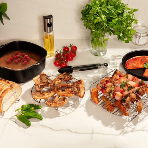 4995-Imagen-2 Imagen 2 Optimiza tu freidora de aire de 5 a 6,5 L con este kit de accesorios Cecofry. Incluye moldes antiadherentes y rejillas para cocinar pizzas y repostería.