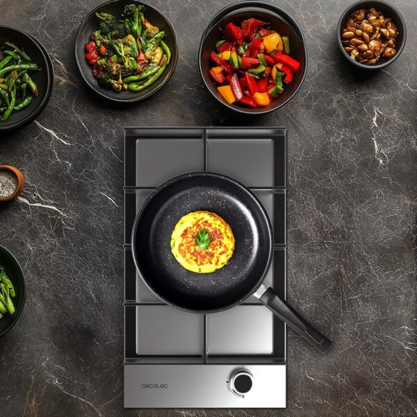 Imagen 6 Placa de gas de acero inoxidable con 4 quemadores, sistema de seguridad termopar y encendido automático. Potencia total de 7 kW para una cocina eficiente.